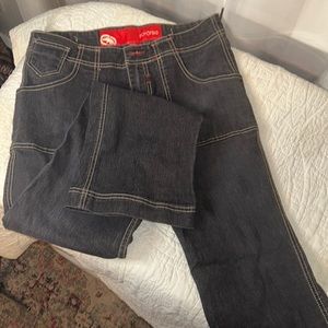 2000s eckored jeans, boot cut, low rise, Dark Denim, light stitching.